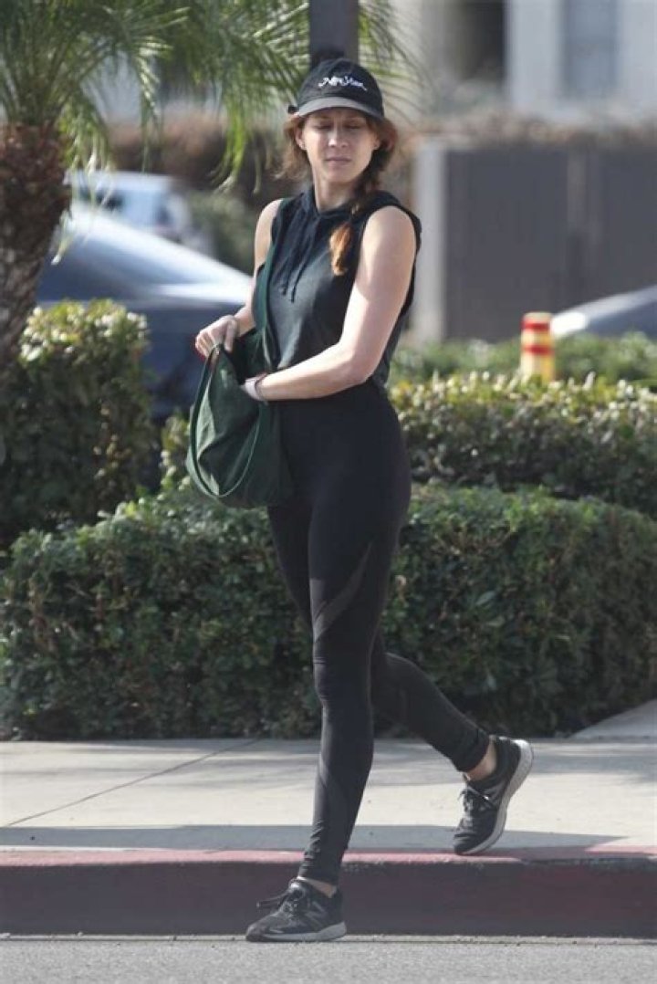 Troian Bellisario in Black Leggings Walks Out with Her Daughter and